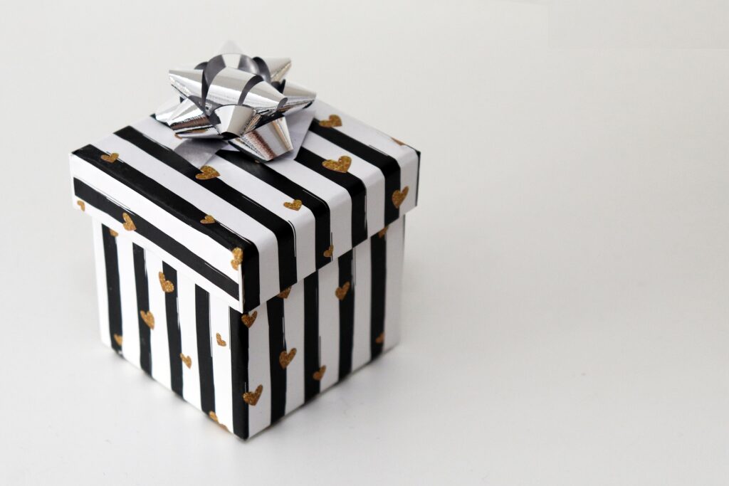 Gift box with smartwatch gift inside, representing the excitement and surprise of receiving a tech gift for any occasion